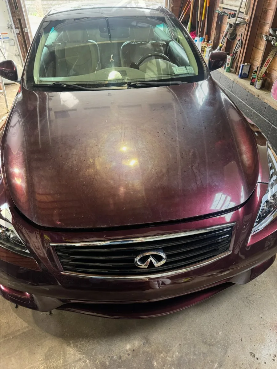 Oxidized maroon Infiniti hood before paint correction